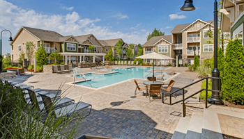 Sparkling swimming pool with lounge chairs
